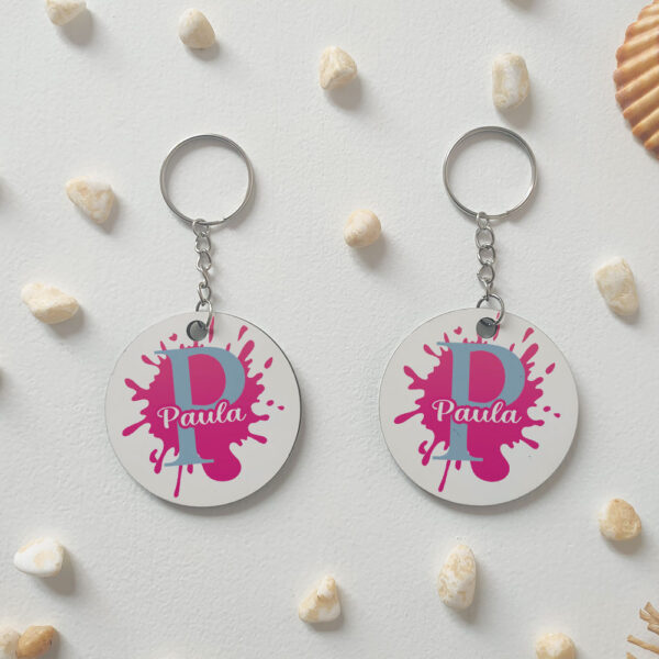 Llavero redondo "Inicial + nombre con gota de pintura" personalizado