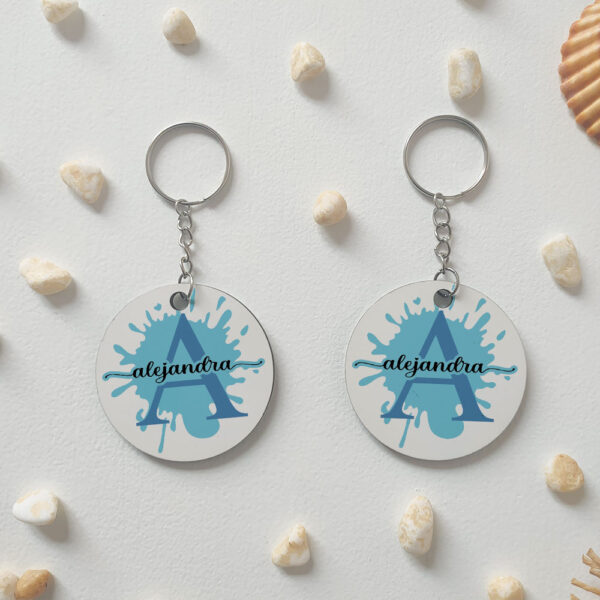 Llavero redondo "Inicial + nombre con gota de pintura" personalizado - Imagen 2