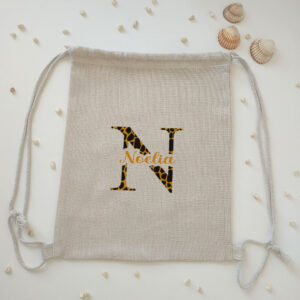 Mochila tipo lino "Inicial animal print + nombre" personalizado